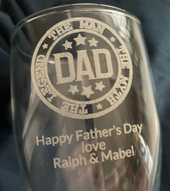 Clear glass with 'DAD' engraving and 'Happy Father's Day' message on a dark background