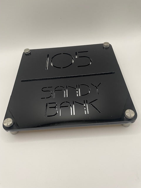 Black metal plate with 'STANDBY BANK' branding on a white background
