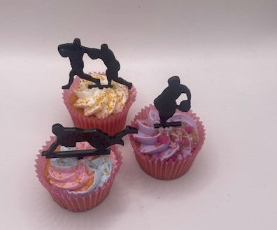 Cupcakes with decorative figures on a white background